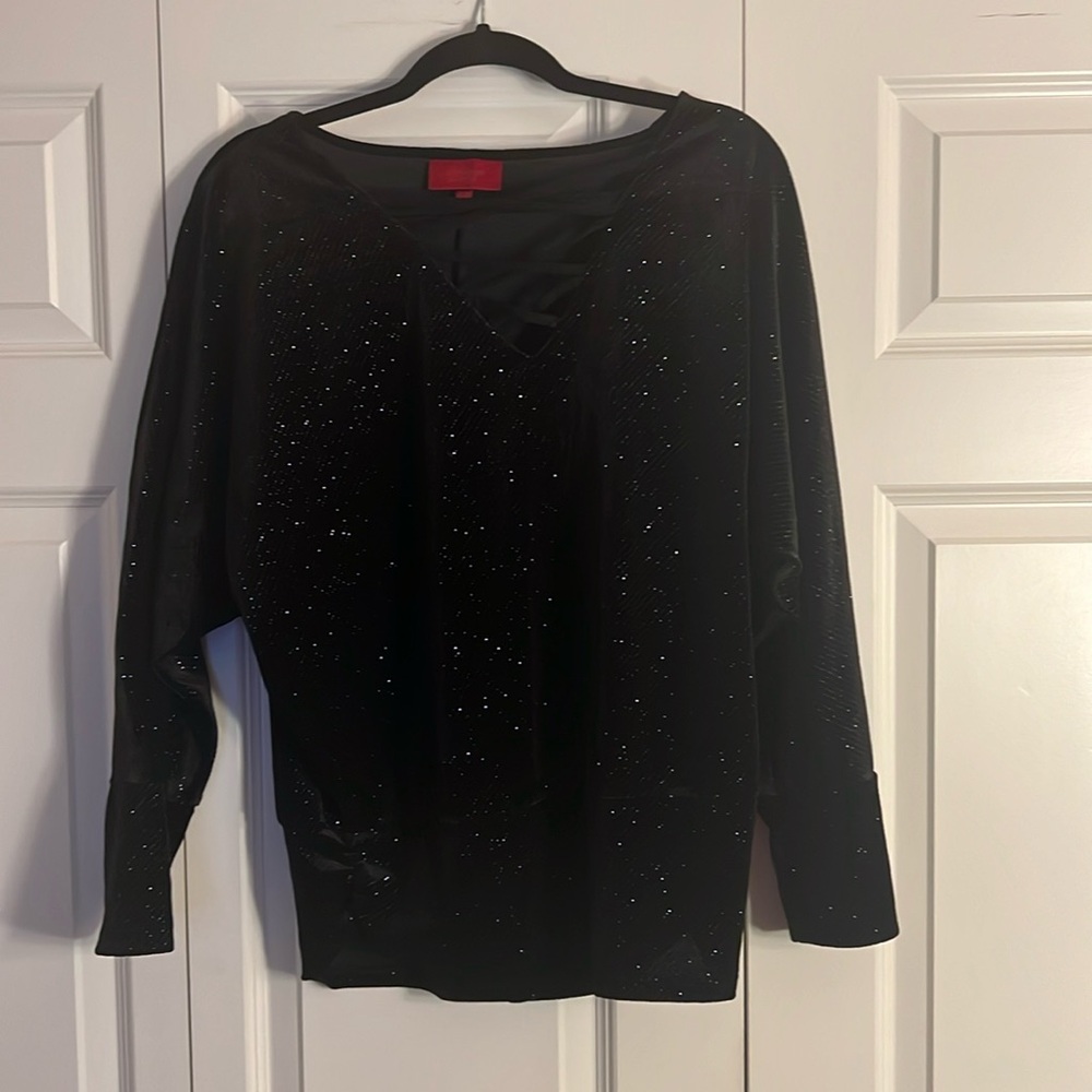 Brand new women's embellished top. Size M. Excellent condition. Jennifer Lopez